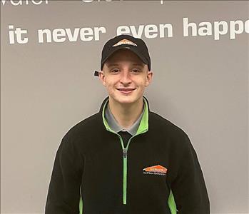 Young man with servpro hat and fleece on