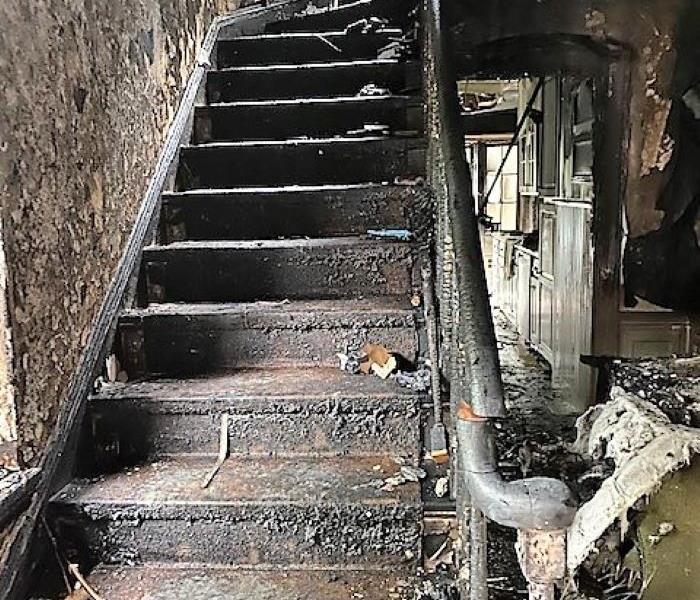 stairwell that is black from fire damage 